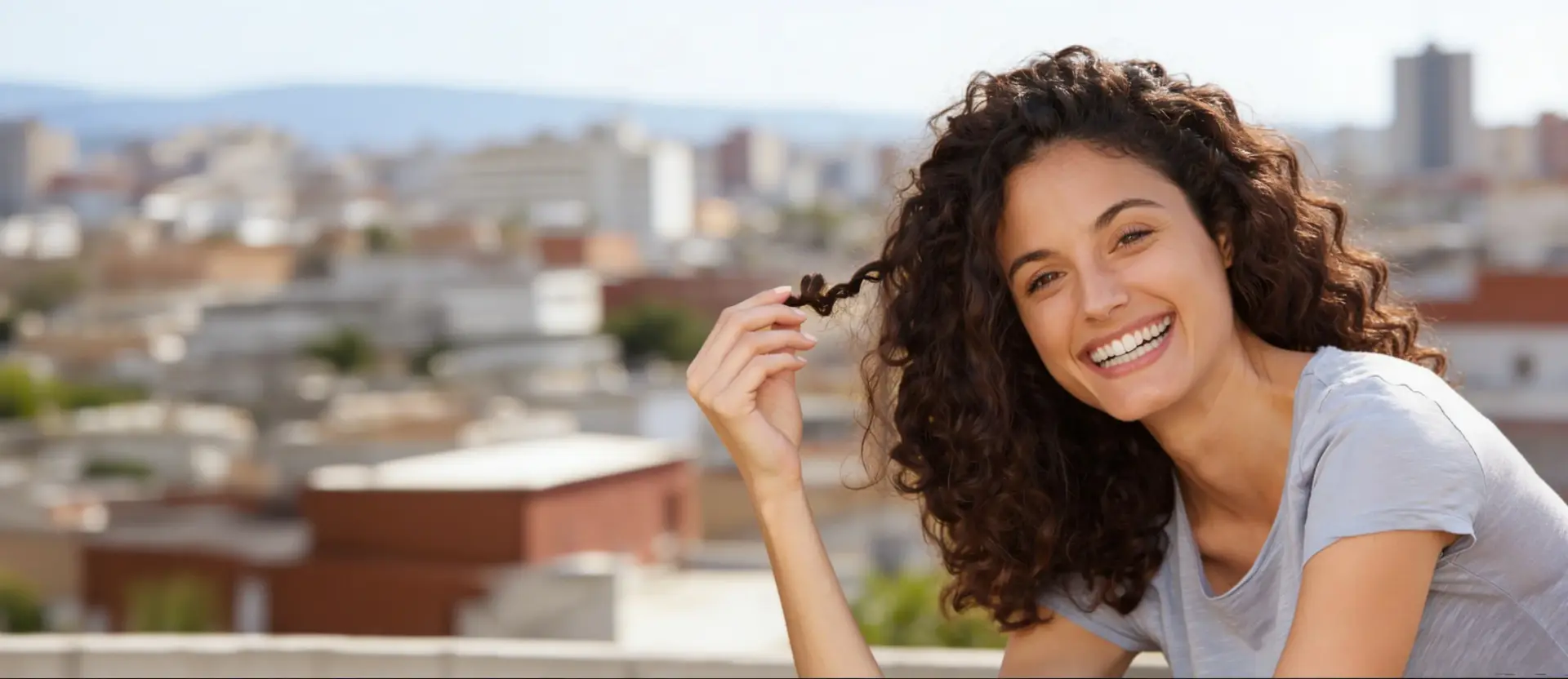 Smiling woman looking away outdoors, representing confidence and satisfaction with hair loss treatment