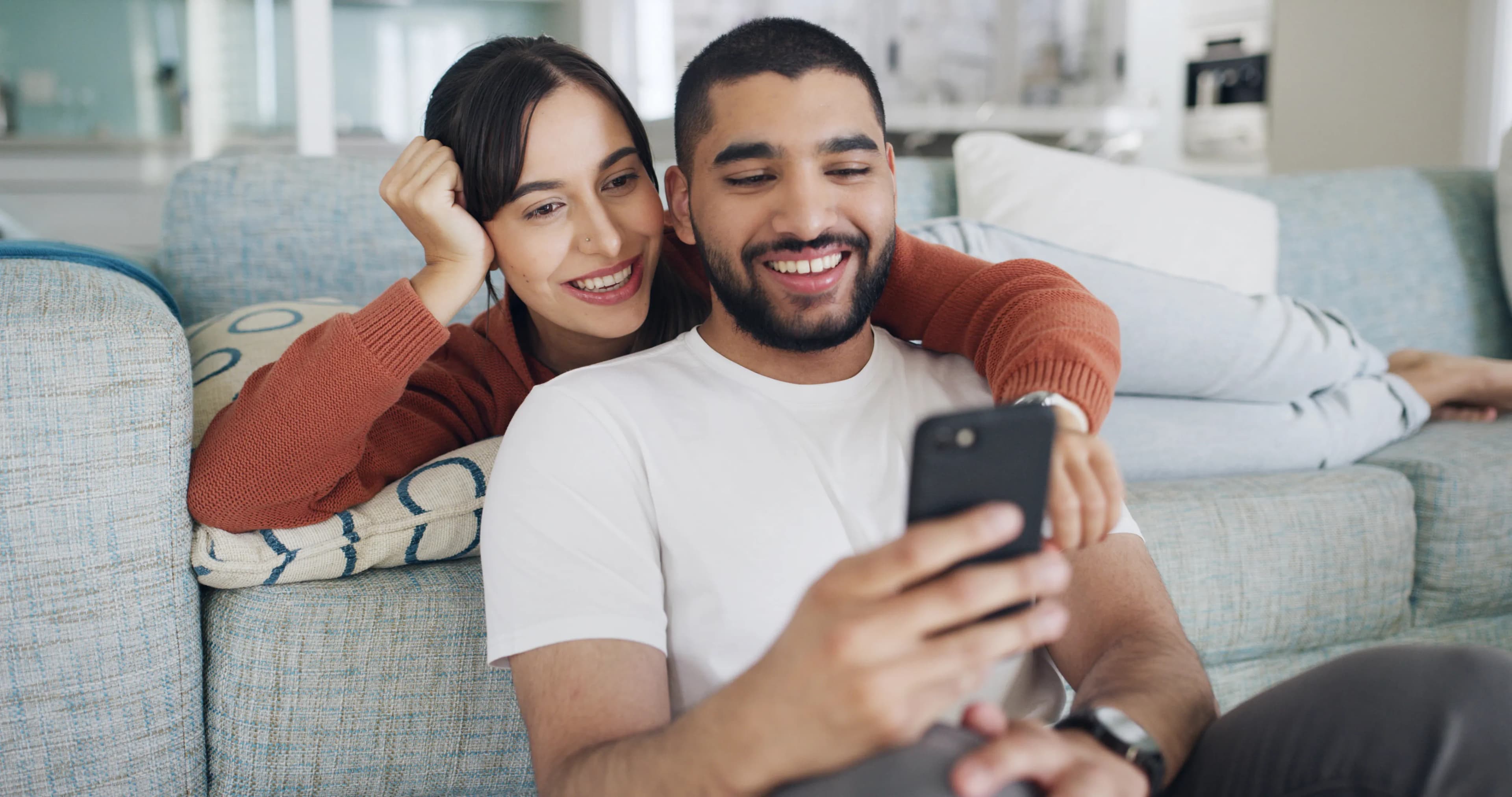 A couple looking at a phone together